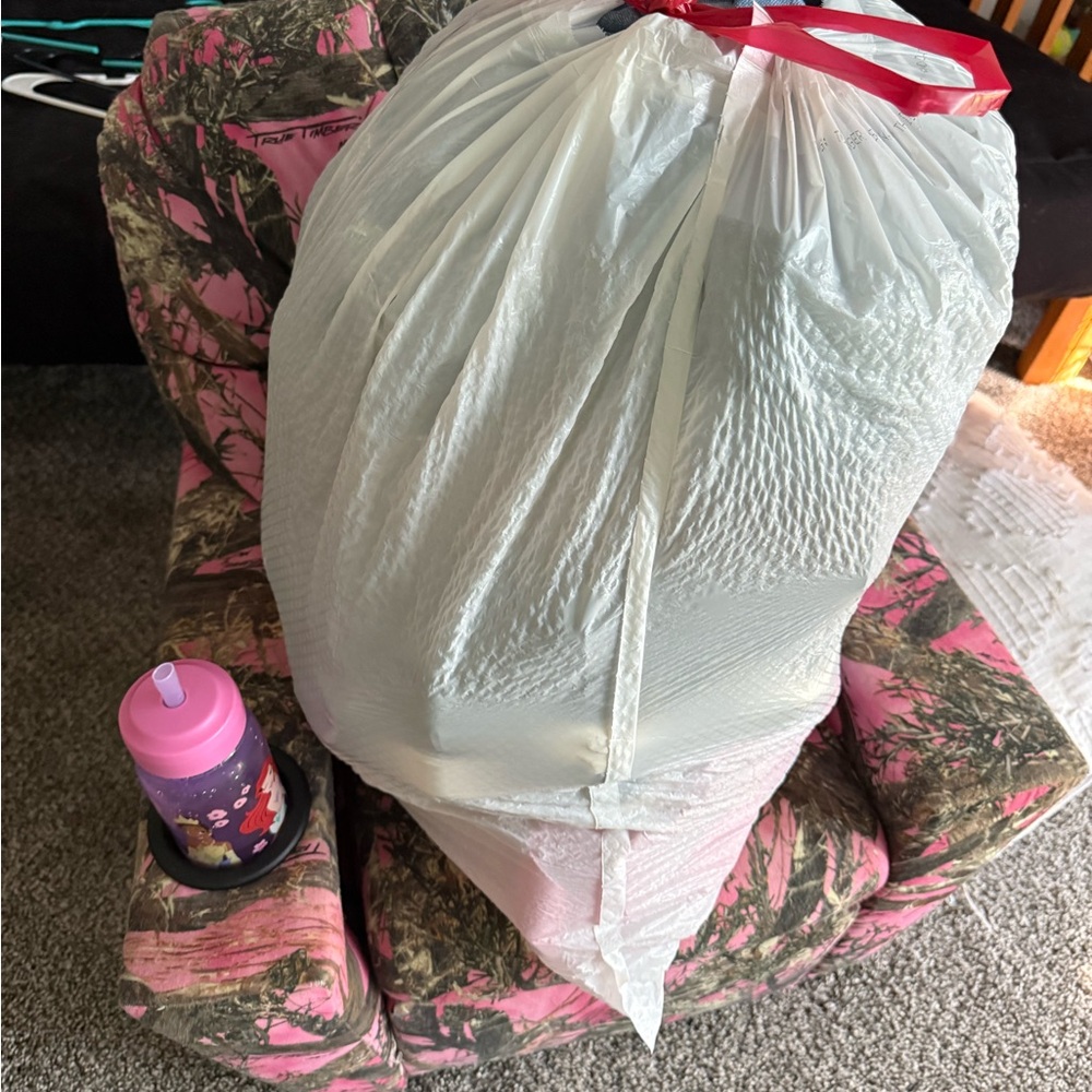 Large White Trash Bag full of clothes shoes and purses 
Will ship out in box!